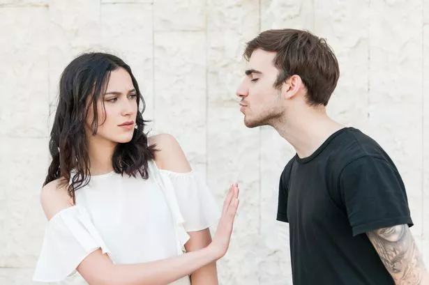Woman Rejecting Man who is going in for a kiss