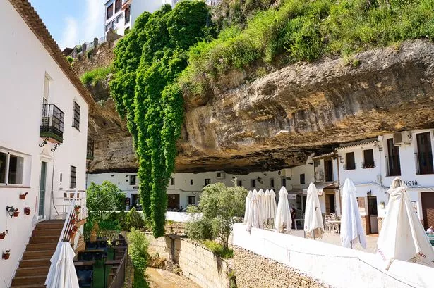 Gastronomy and Shops in the Gorge under the rock along the small Mountain stream río guadalporcún in the andalusian village of setenil de las Bodegas (Cádiz province, spain). SETENIL DE LAS BODEGAS IN May 2022.
