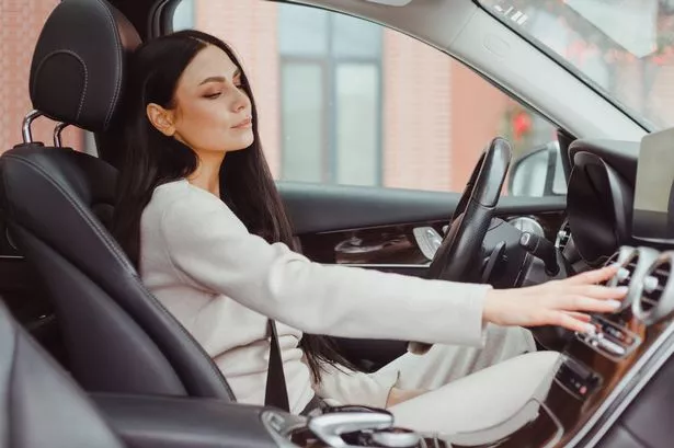 Woman touring on Tsar Air Air System On Dashboard in Car Panel, Auto Car Air Condition.