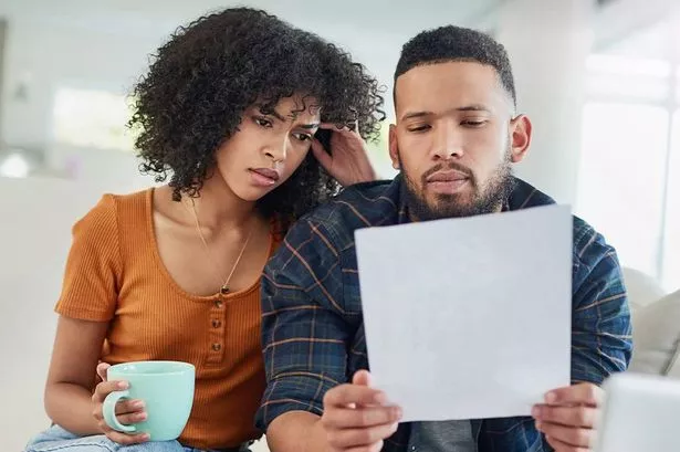 A couple check their bills