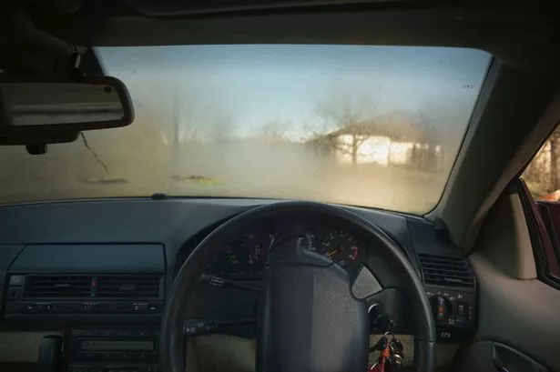 Car windshield covered in fog