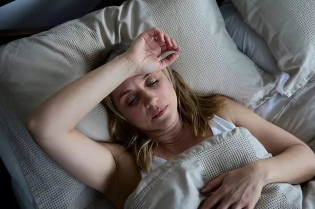Woman Sweating in Bed