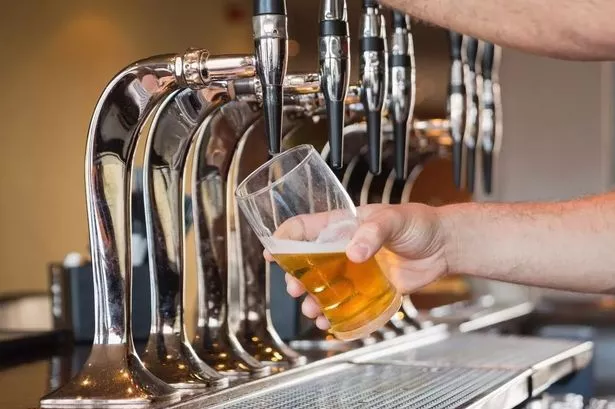 Pouring a pint at the bar