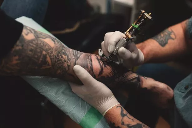 A person getting tattooed