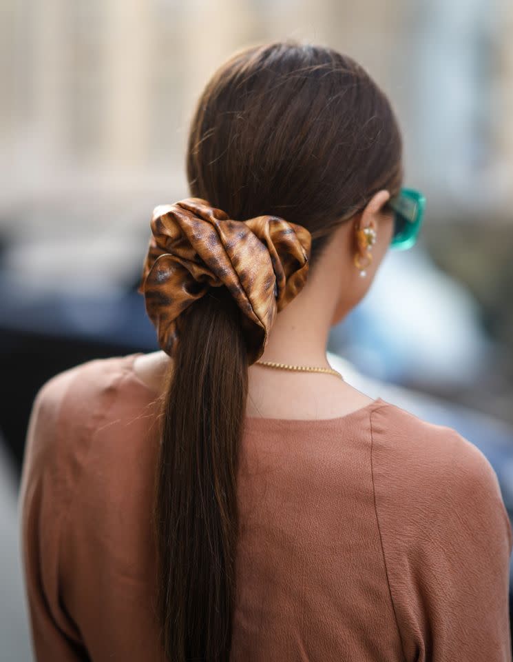 Getty Images Coconut oil can add so much shine to your hair.
