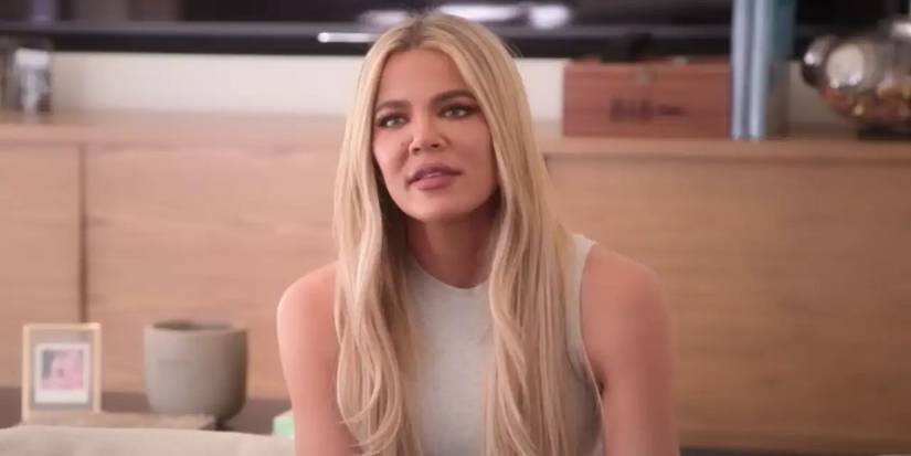 The Kardashians Star Khloe Kardashian Wearing White at Table