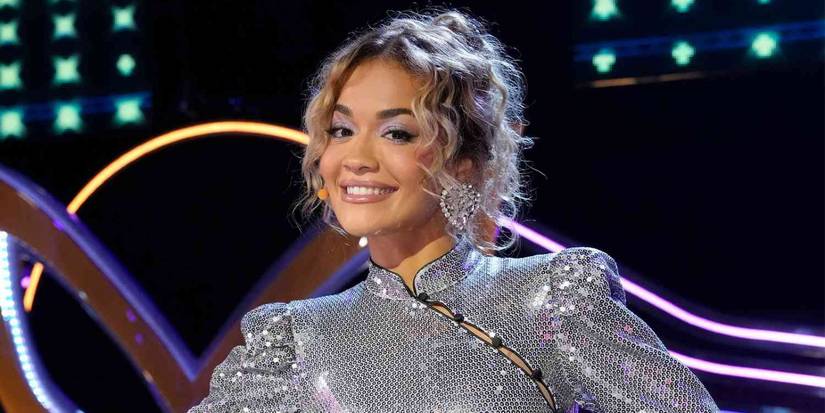 Rita Ora smiling in a promotional image for The Masked Singer