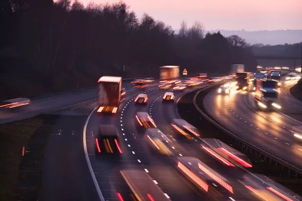 Busy traffic looking west at dusk on the M42 Motorway. Shot from Junction 3, the A435 junction, just south of Birmingham.