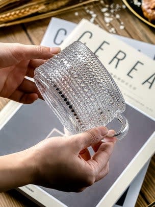 A set of stunning vintage-inspired glass coffee mugs that add a pop of elegance